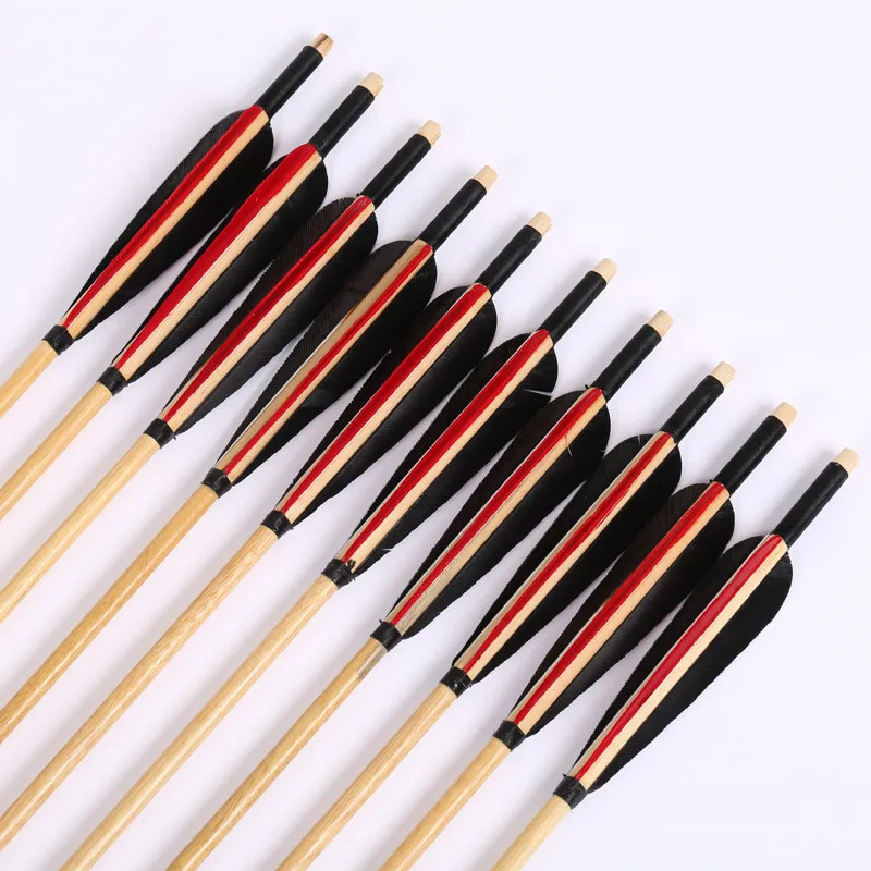 wooden arrow with turkey feather for traditional archery bow hunting and shooting