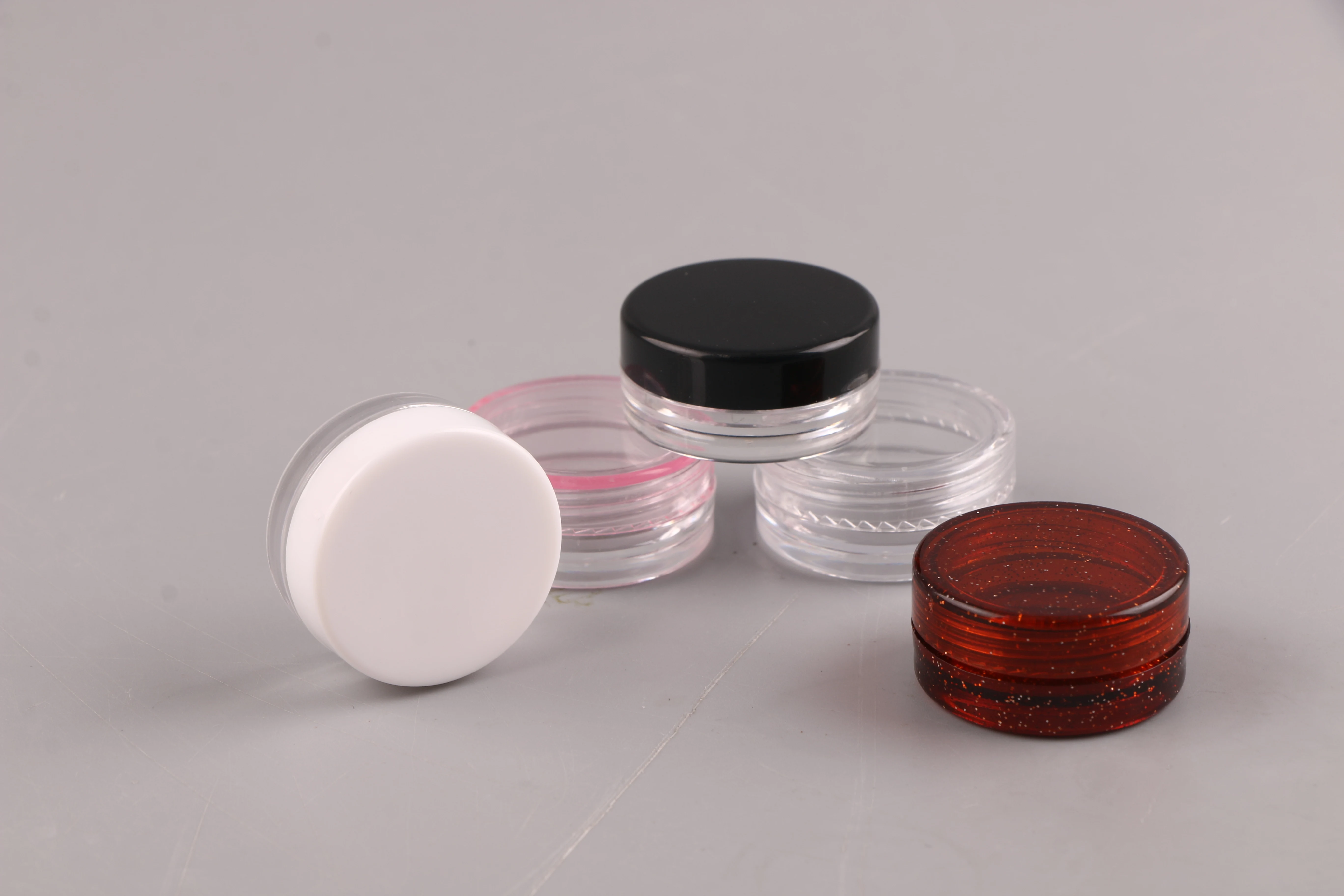 
Wholesale cheap round 3 ml PS plastic empty cosmetic packing cosmetic bottles cream jars 