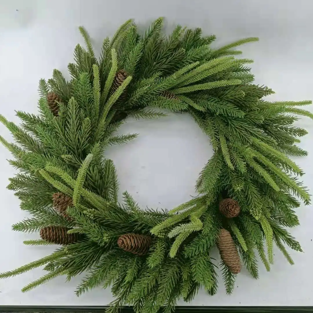 Artificial pine needles and pinecone wreath for Christmas