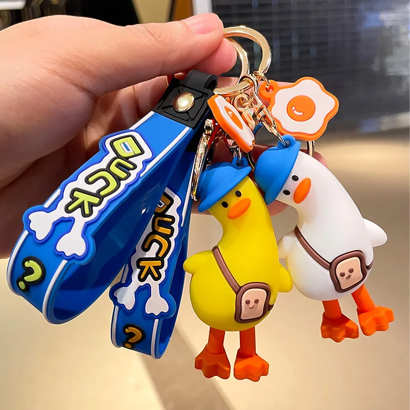 Funny tilt head duck cute anime pvc 3d keychain custom logo pvc rubber keychain Key Handbag Accessories