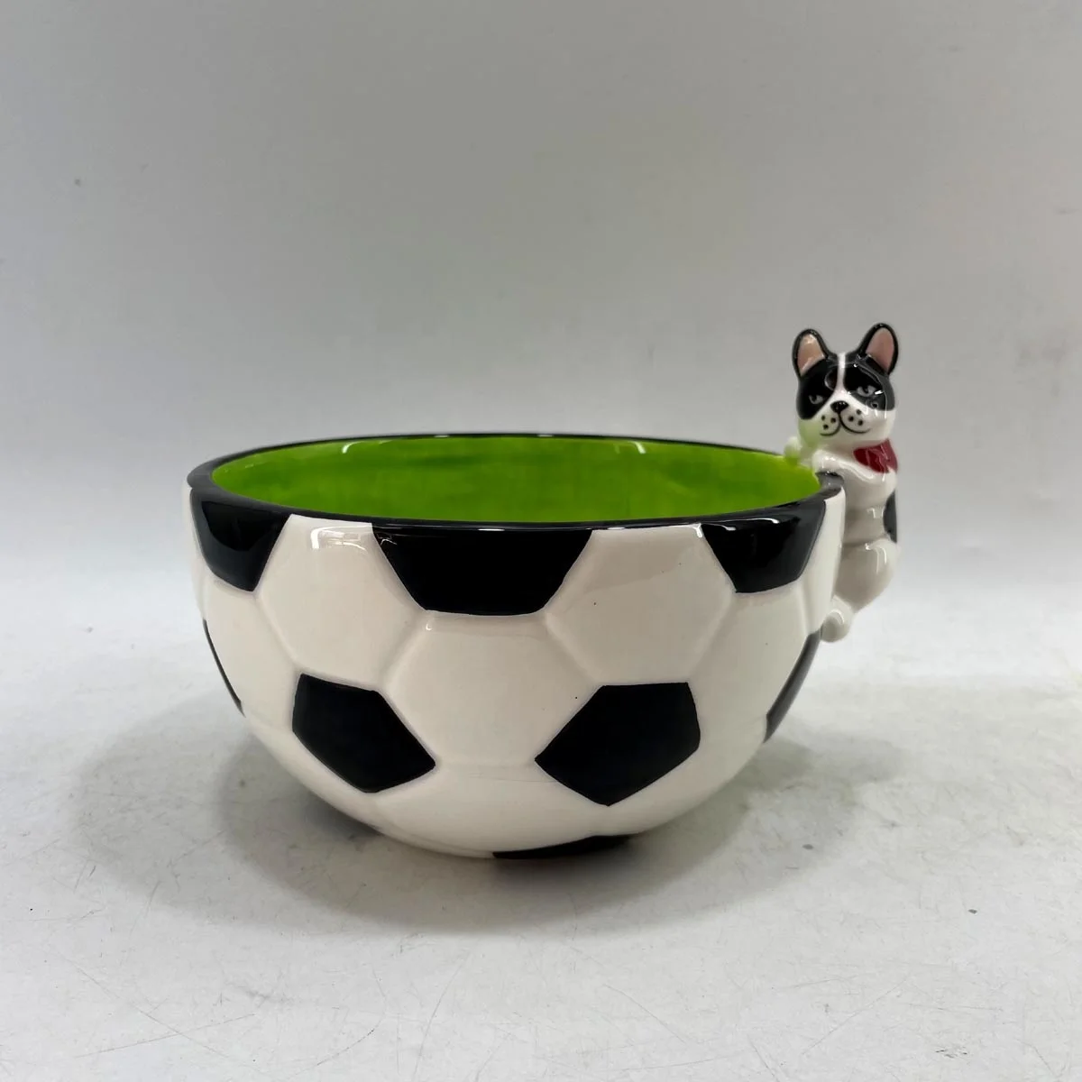 Hand painted ceramic football shaped candy bowl with dog handle