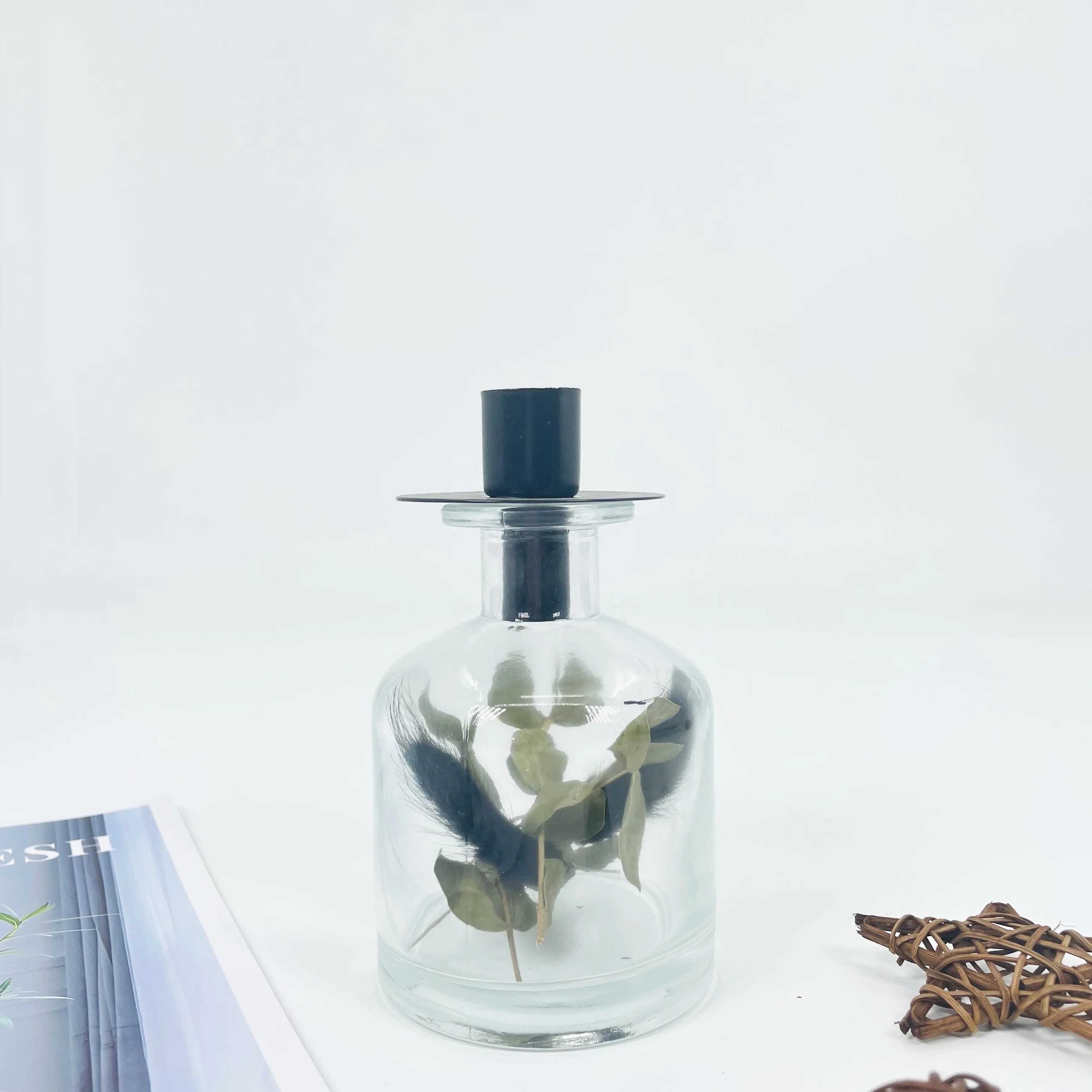 handmade glass candle jar with dried leafs for Nordic market