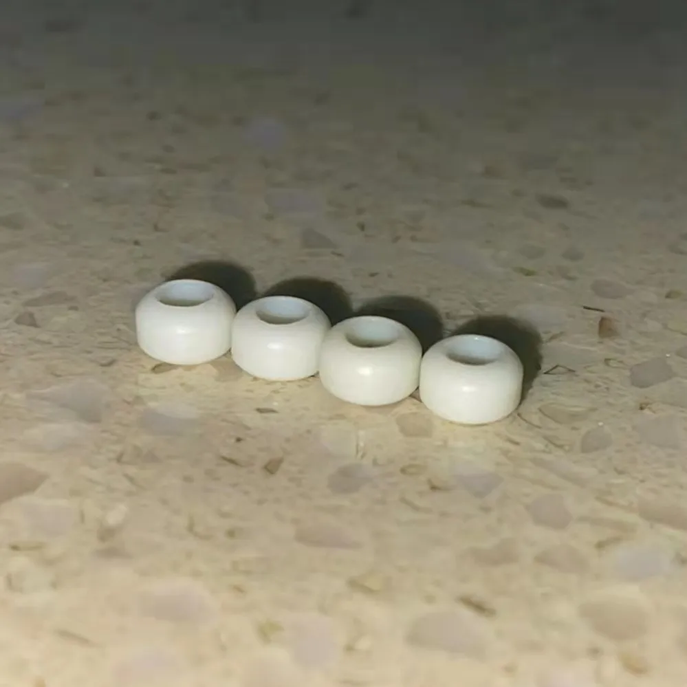 White handmade fingerboard wheels