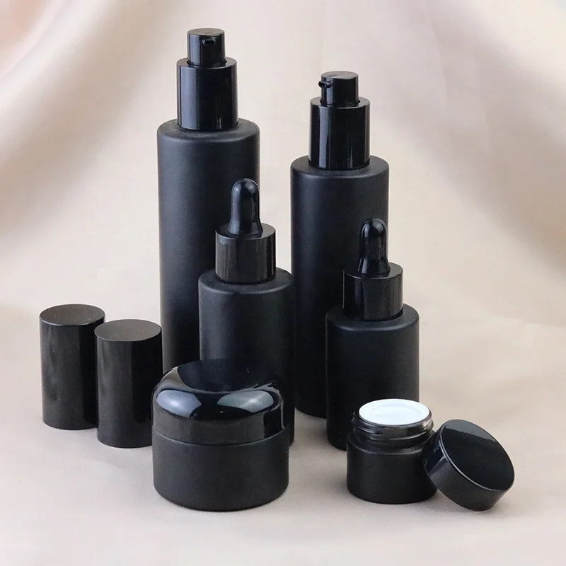 Fancy empty cylinder round 30ml 50ml 60ml 100ml 120ml matte black glass cosmetic emulsion bottles packaging with pump (GLC09)