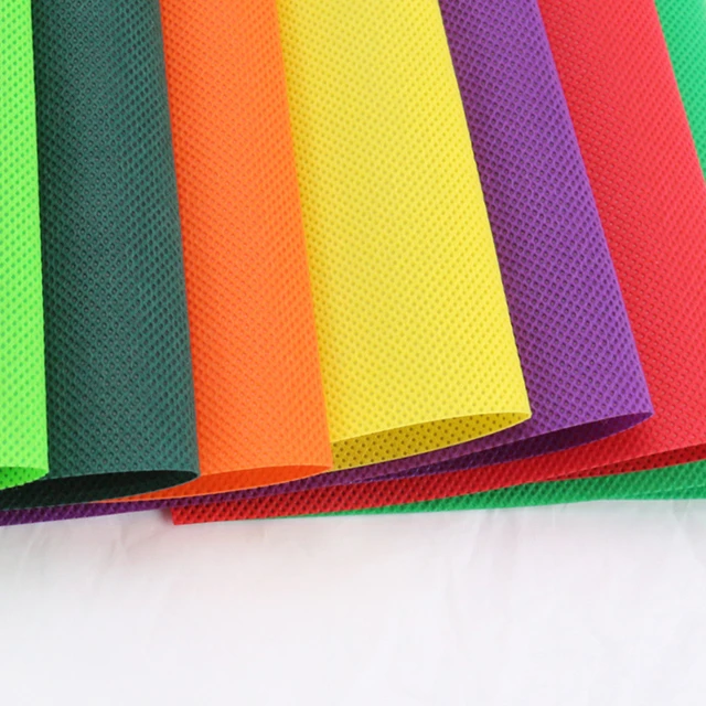 Красочные выбивает pp spubonded нетканый материал PP закрученный Бонд нетканый рулон ткани Малайзия