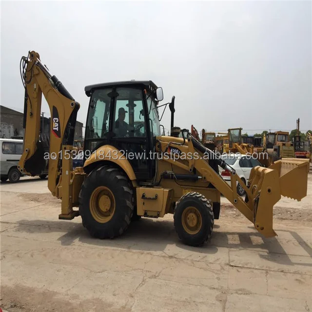 Реальный снимок экскаватора-погрузчика catapillar CAT430F