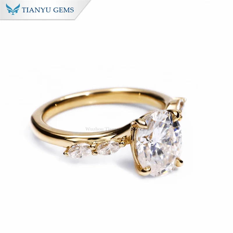 Tianyu gems yellow gold Oval centre diamond with Marquise cut stones on the shoulders engagement ring