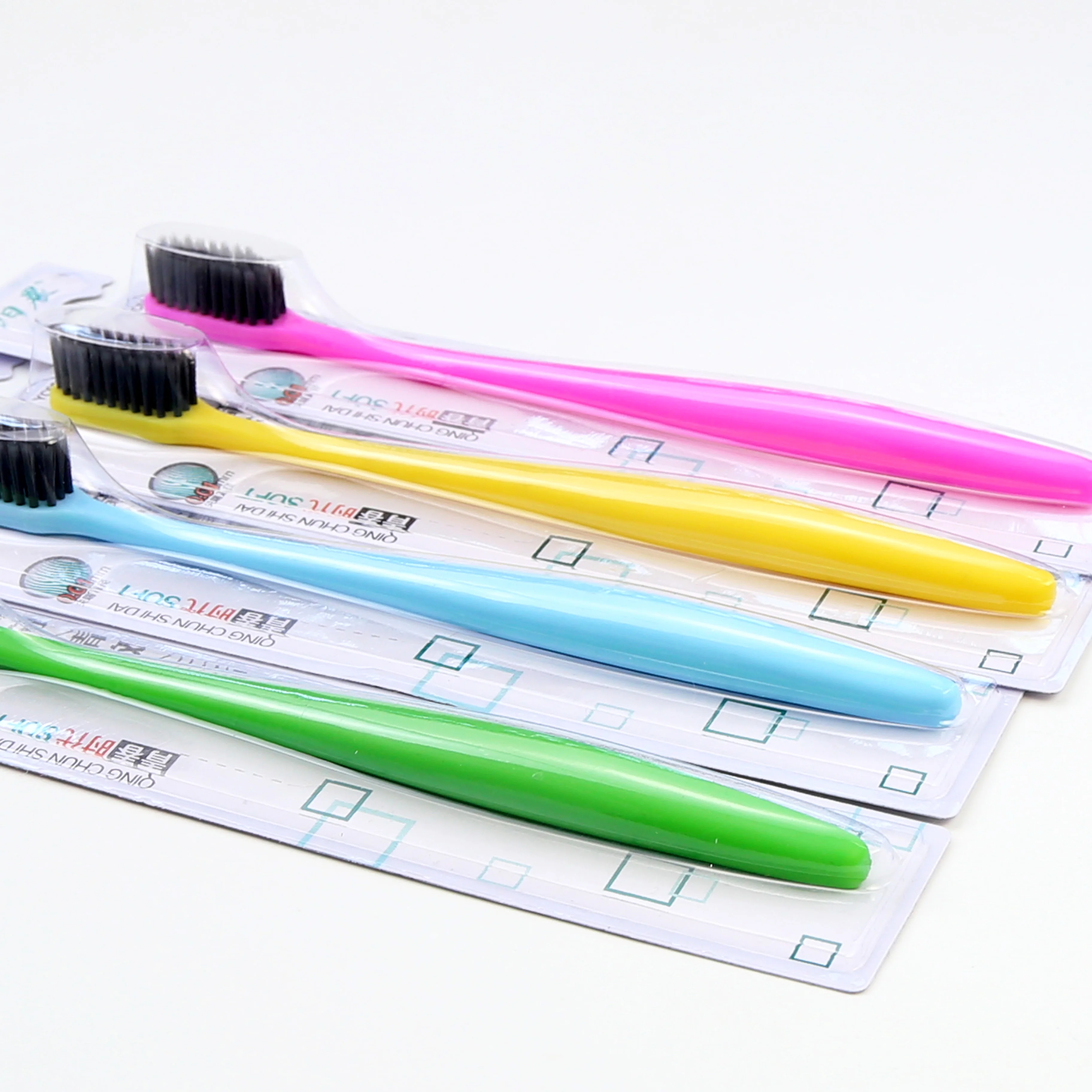 Popular Plastic Yoothbrush with Soft Charcoal Filament Individual Blister Card In one 30pcs Tray Sunny Morning Brand