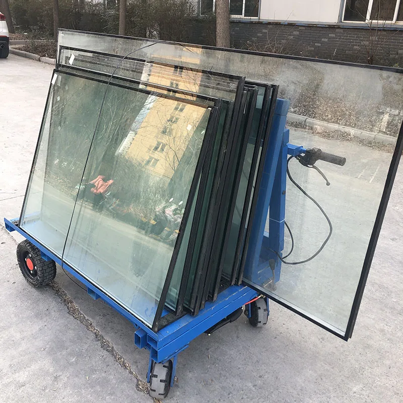 Chinese factory workers transport glass trucks electric trolley fitted with glass