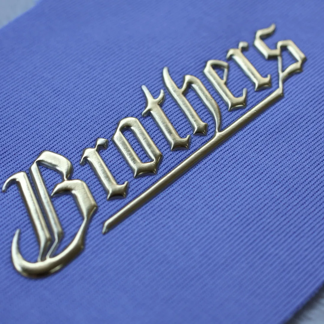 Custom High Quality Golden TPU Heat Transfer Sticker Soft 3D Embossed Patches Badges for Garments
