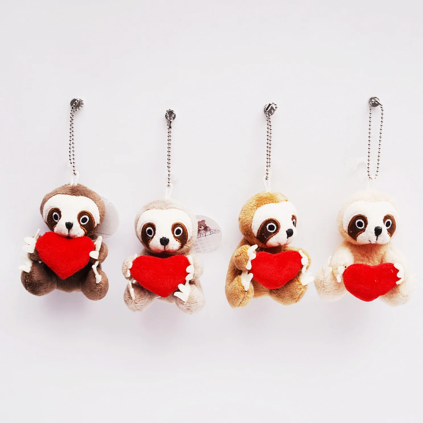 best selling cute heart holding sloth keychain adorable unique heart holding sloth keychain OEM ODM New eco-friend fabric