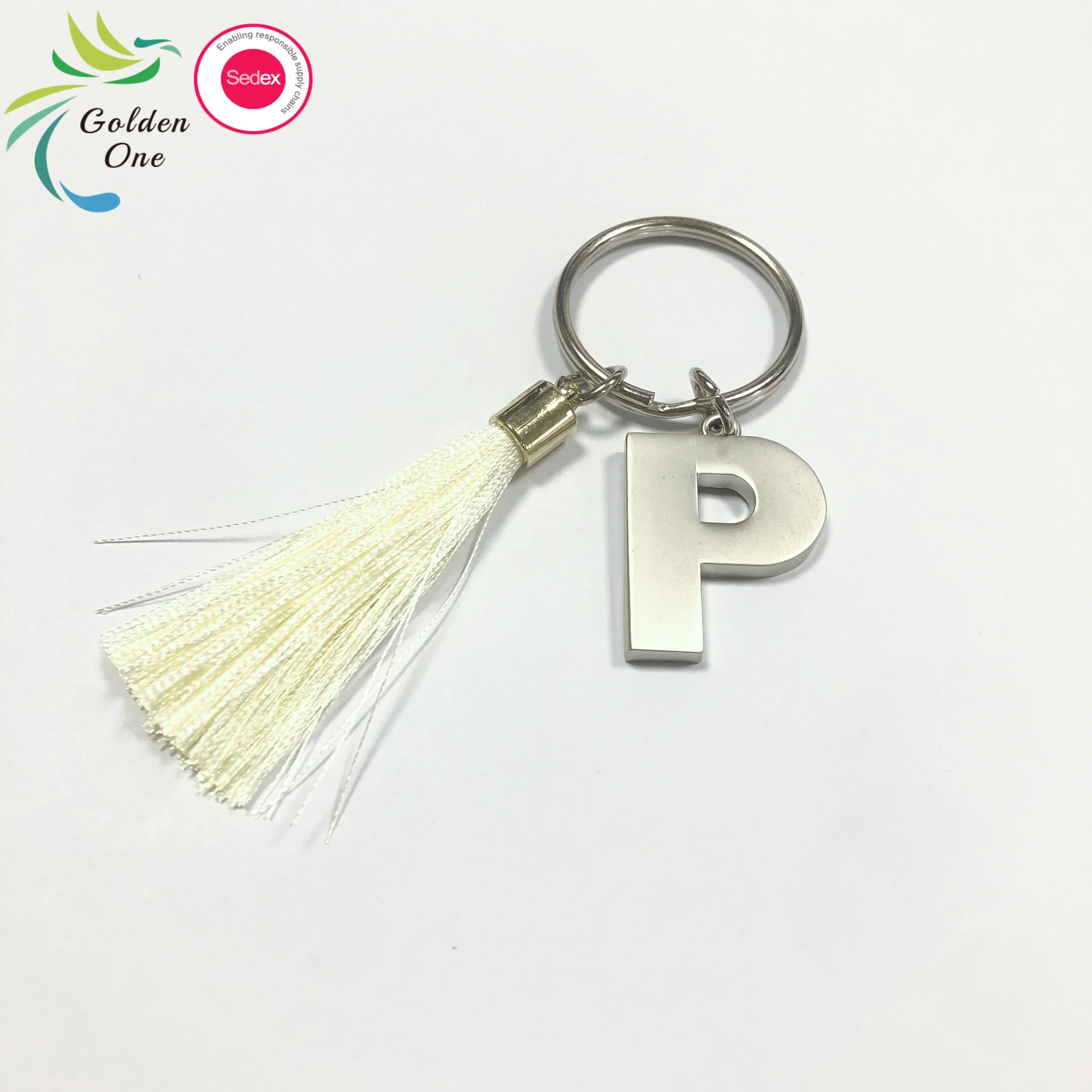 new design manufacturer colored fringe gift key chain 26 letters printing logo fashion metal keychain for bags