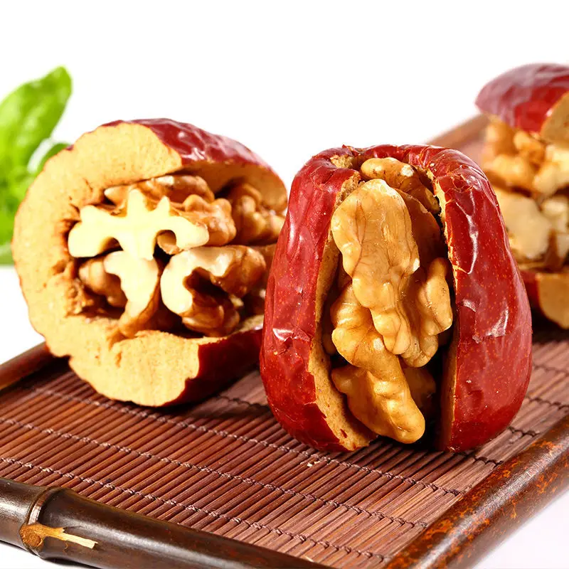 Handmade walnut kernels and red dates for producing nut snacks