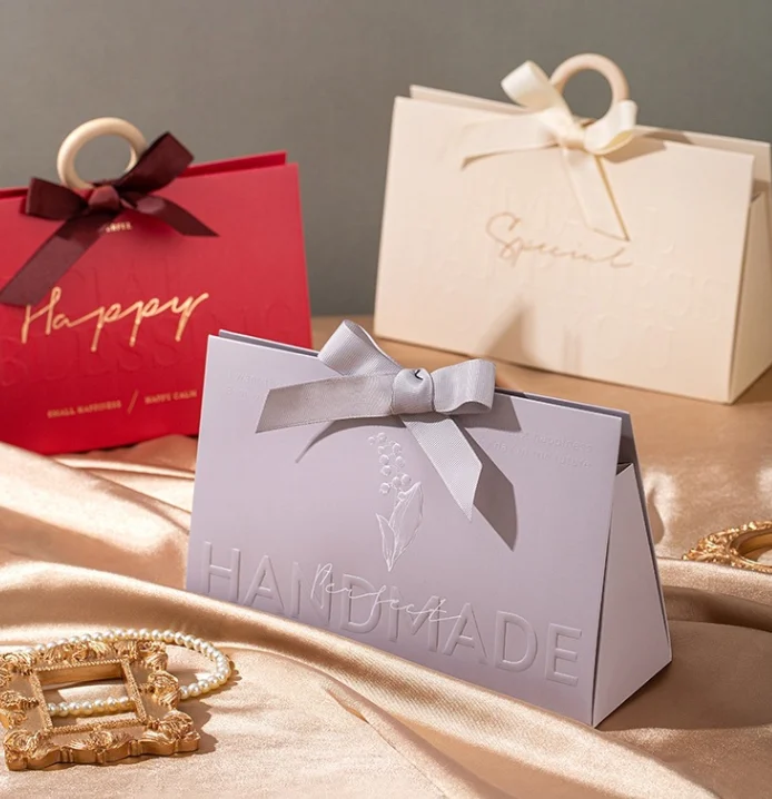 Высококачественный Оптовый дешевый бумажный пакет Victoria Secret с ленточной ручкой, роскошные бумажные пакеты с тиснением для нового дизайна