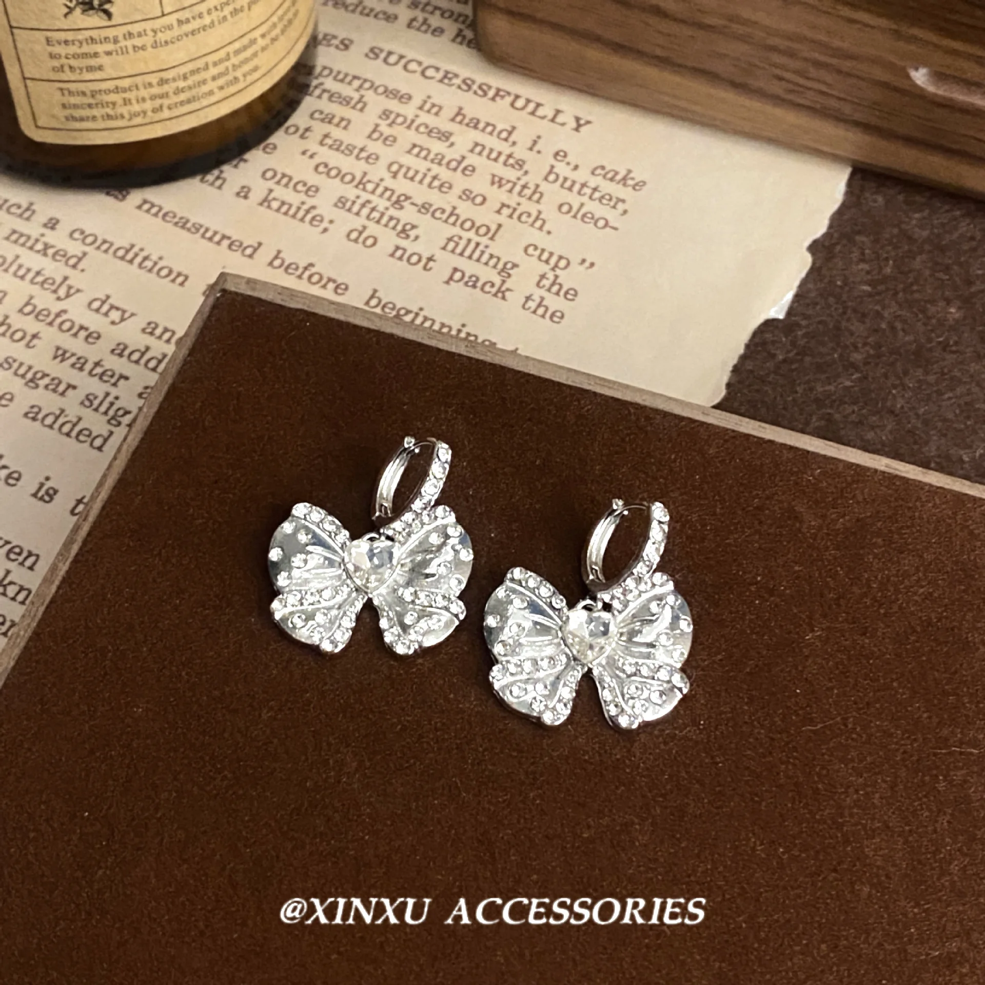 Bow ear female 2024 new fashion summer niche design sense of advanced micro-diamond earrings sweet temperament