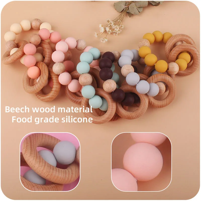 Hot Sell Newborn Silicone Beads Diy Baby Silicone Rattle Wrist Ball Teether Ring Beech Wooden Teething Ring Toys Bebe Gift