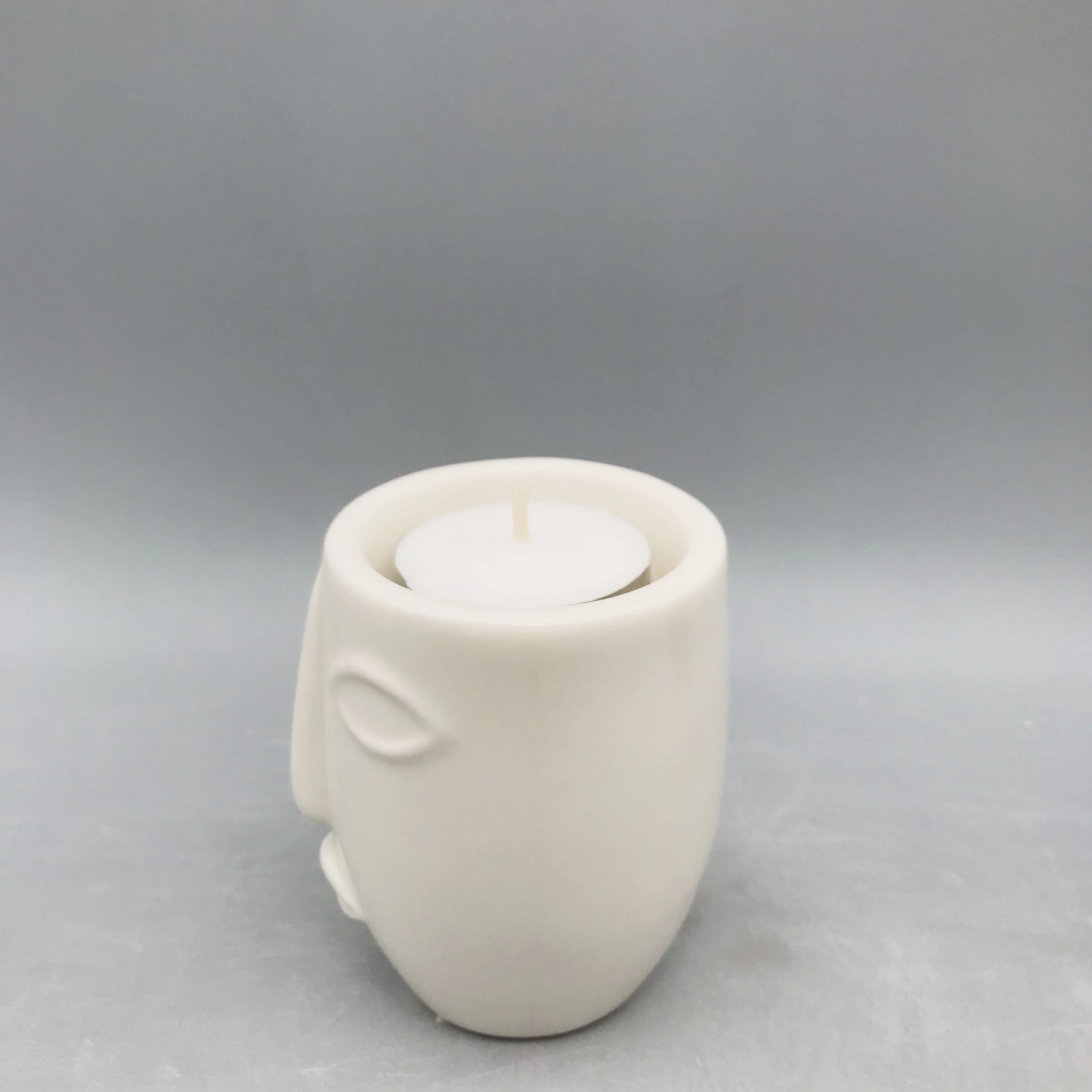
Customized black and white ceramic human face candle holder 