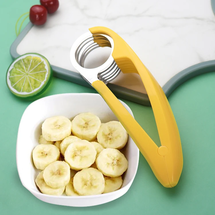 Fruit and vegetable salad peeler cutter kitchen equipment for bananas in stainless steel with a plastic grip