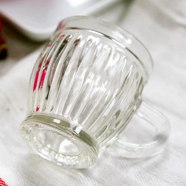 Xuzhou Stocks China Manufacture Wholesale Ribbed Pudding Bottle with Handle 130ml Coffee Tea Drinking Glass Cup