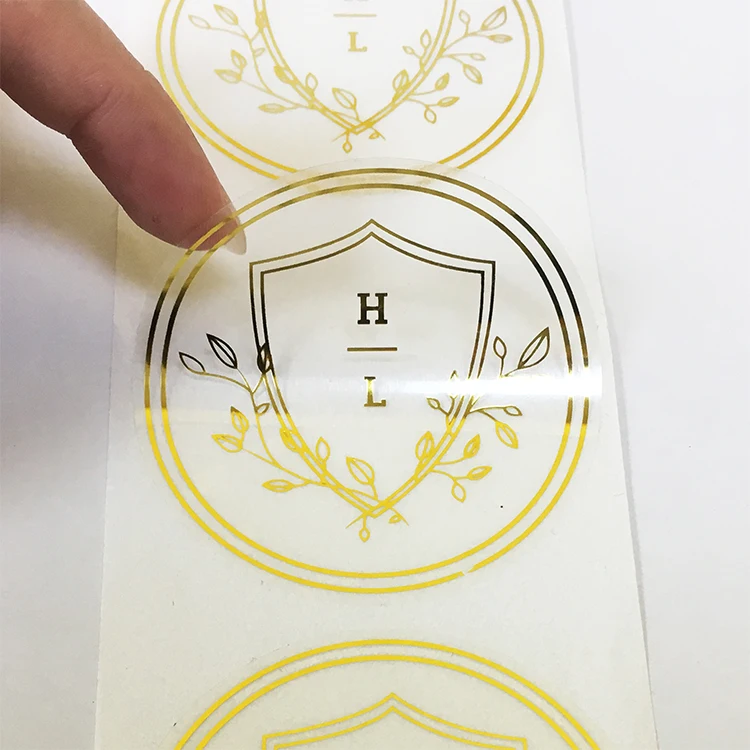 Custom roll logo printing adhesive waterproof gold foil clear vinyl logo label transparent stickers for packaging