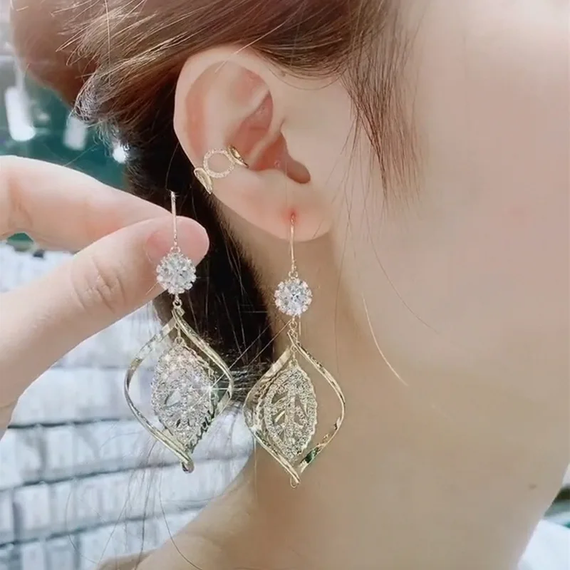 2024 модные ювелирные изделия оптовая продажа фабричные преувеличенные спиральные металлические серьги с листьями глянцевые позолоченные геометрические