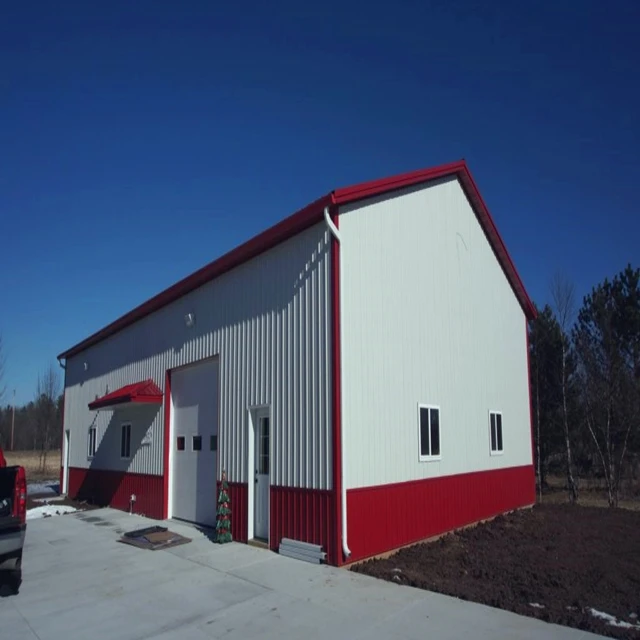 Steel warehouse for a construction site with parapet wall cladding