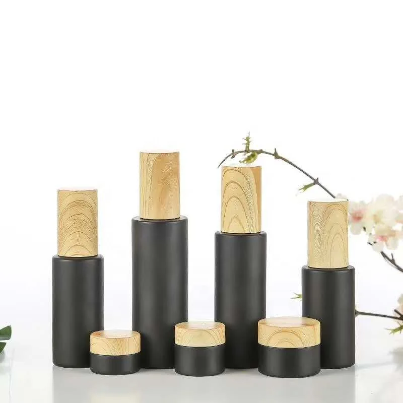 
New style 5ml 10ml 15ml 20ml 30ml 50ml 80ml 100m Round Shape Matte Black Essential Oil Glass Bottle with Bamboo spray pump 
