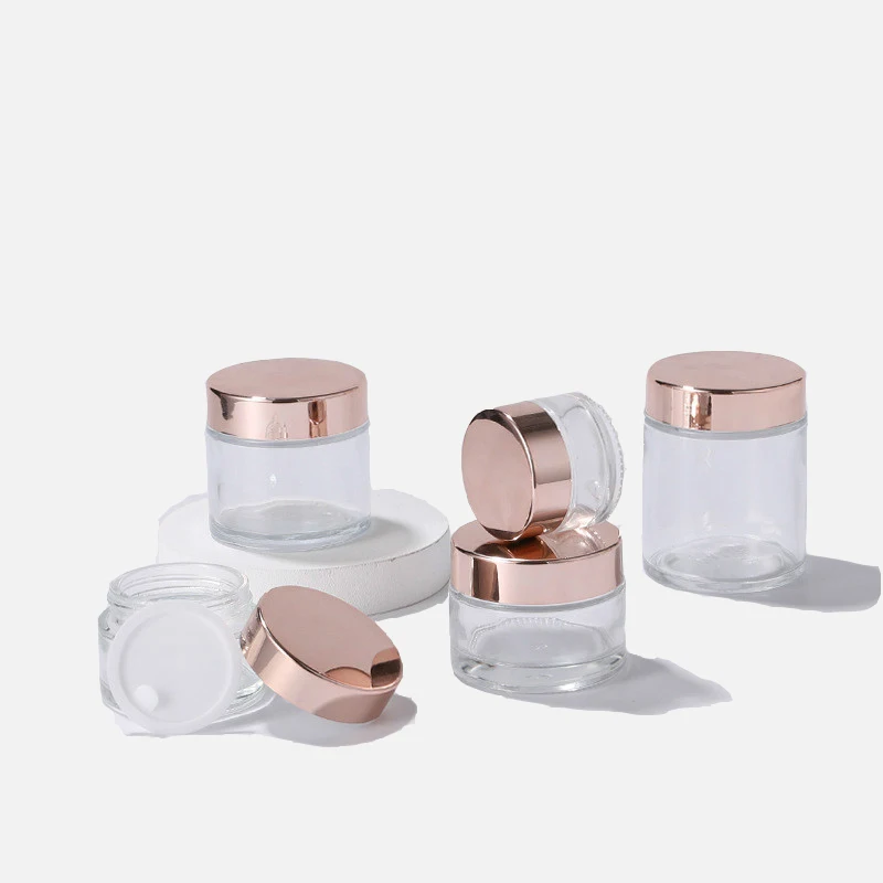 
cosmetic cream clear glass 50ml jar with silver gold and rose gold covers 