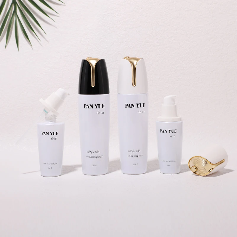 The latest lotus shaped empty glass bottle set with plastic plating lid for cosmetics skincare packaging wholesales