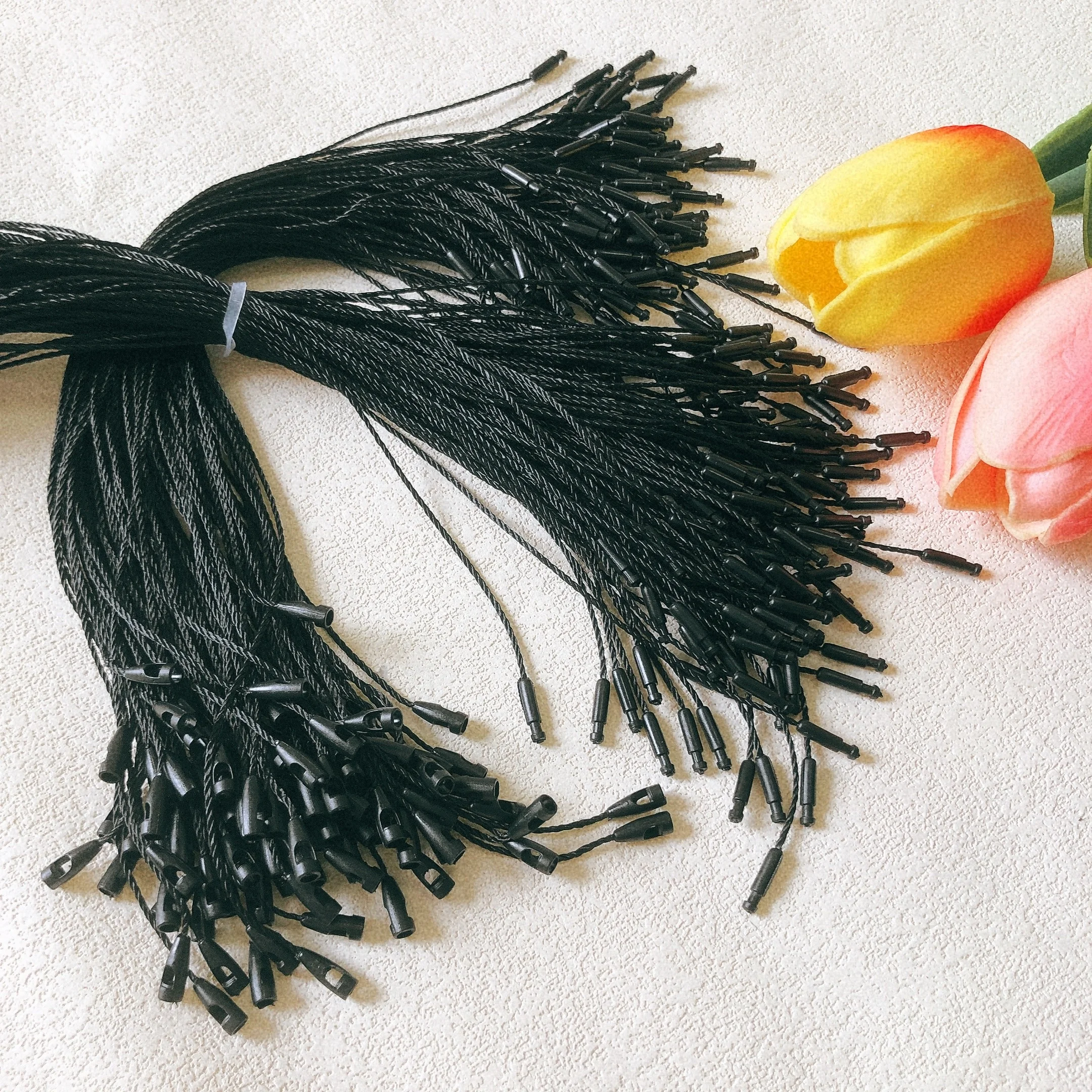 Clothing accessory polyester biodegradable hangtag BulletHead black string knotting