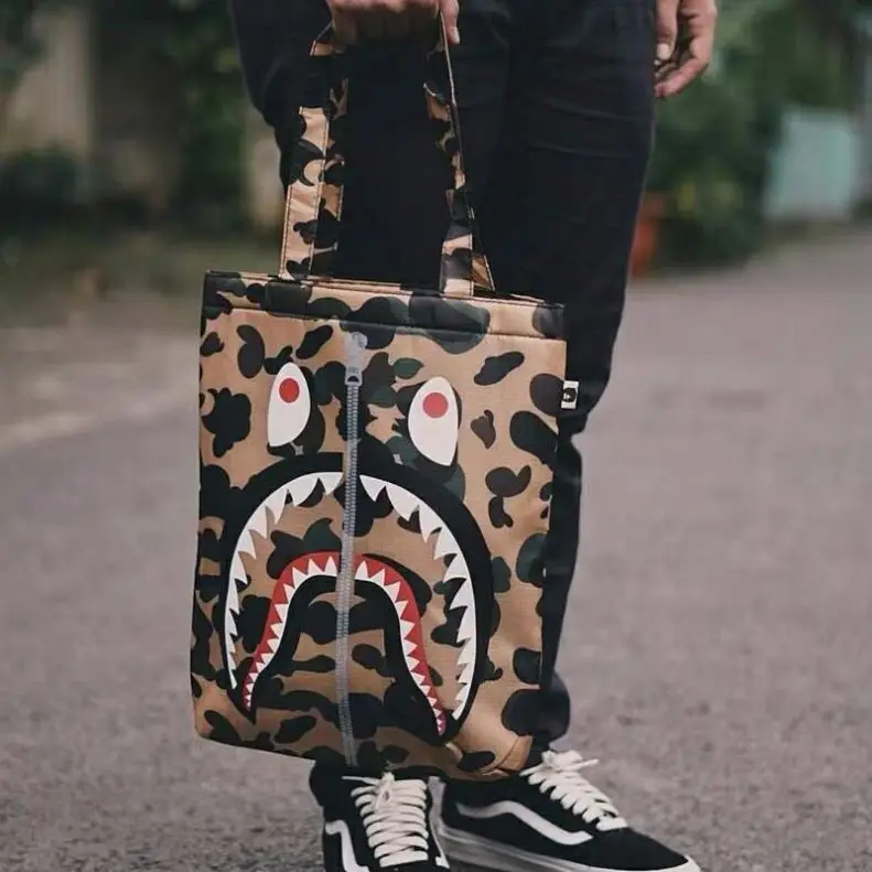 INS Hot BAPE Bags Camouflage Shark Red Eyes Black Teeth Print Simulated Zipper Tote Bags Trendy Shoulder Couple Bags