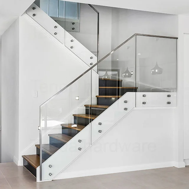 Fully frameless glass balustrade with top mounted timber handrail