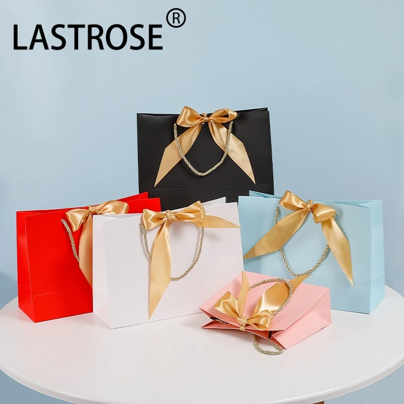 Wholesale Pink Luxury Eyelashes Packaging Paper Shopping Bag With Handle Private Label Empty Paper Gift Bags