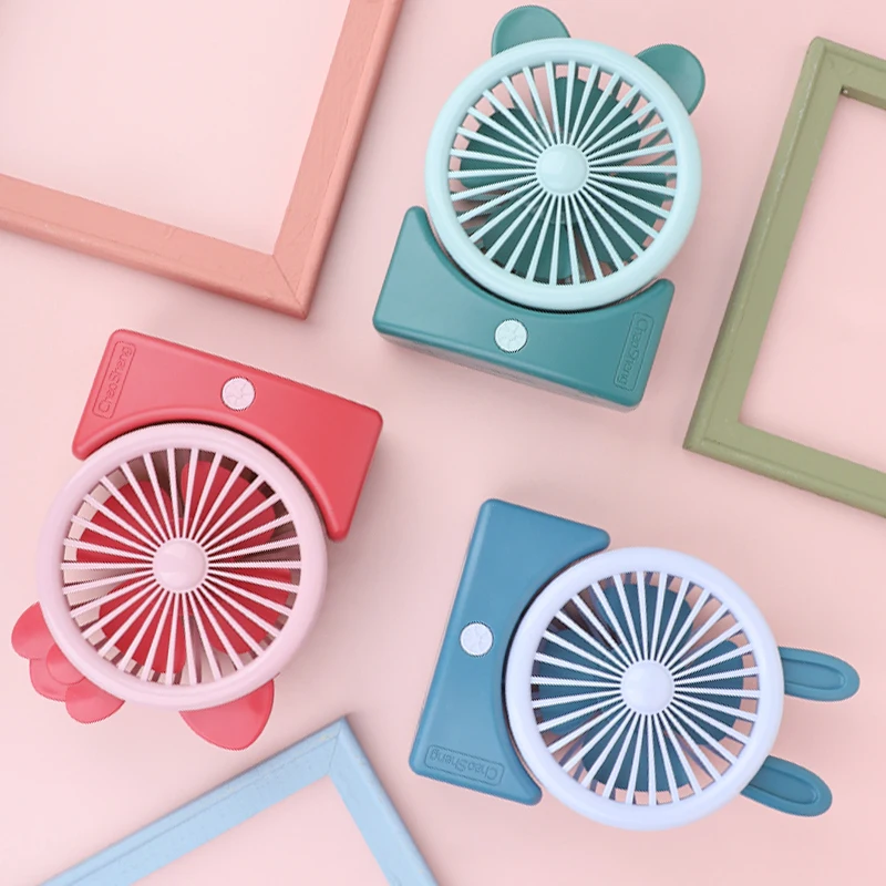 Wholesale cartoon mini desk fan quiet USB rechargeable handheld fan student gift