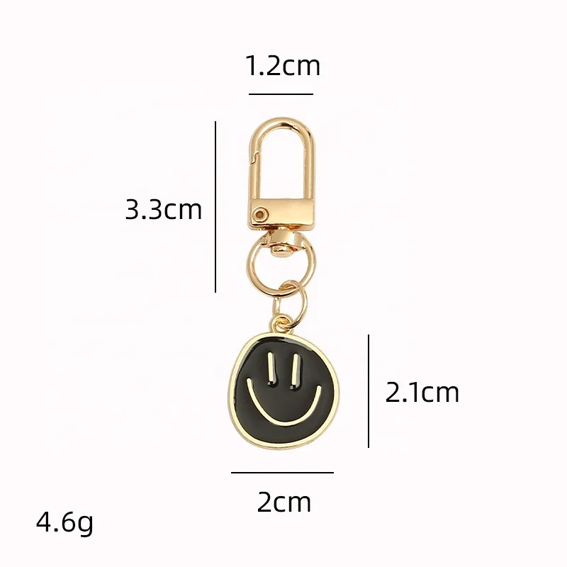 Hot selling cute smiling face pendant zinc alloy keychain candy color versatile smiling face keychain