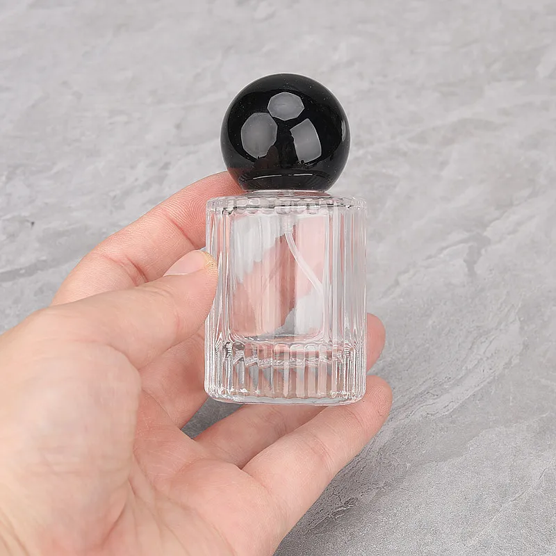 Wholesale 30ml Cylinder Fragrance Glass Bottle 50ml Transparent Vertical Line Round Perfume Spray Bottle with Round Ball Cap