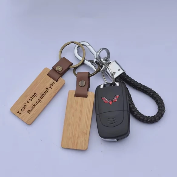 Factory direct selling 100% natural organic cute carving bamboo keychain plus logo key ring tags