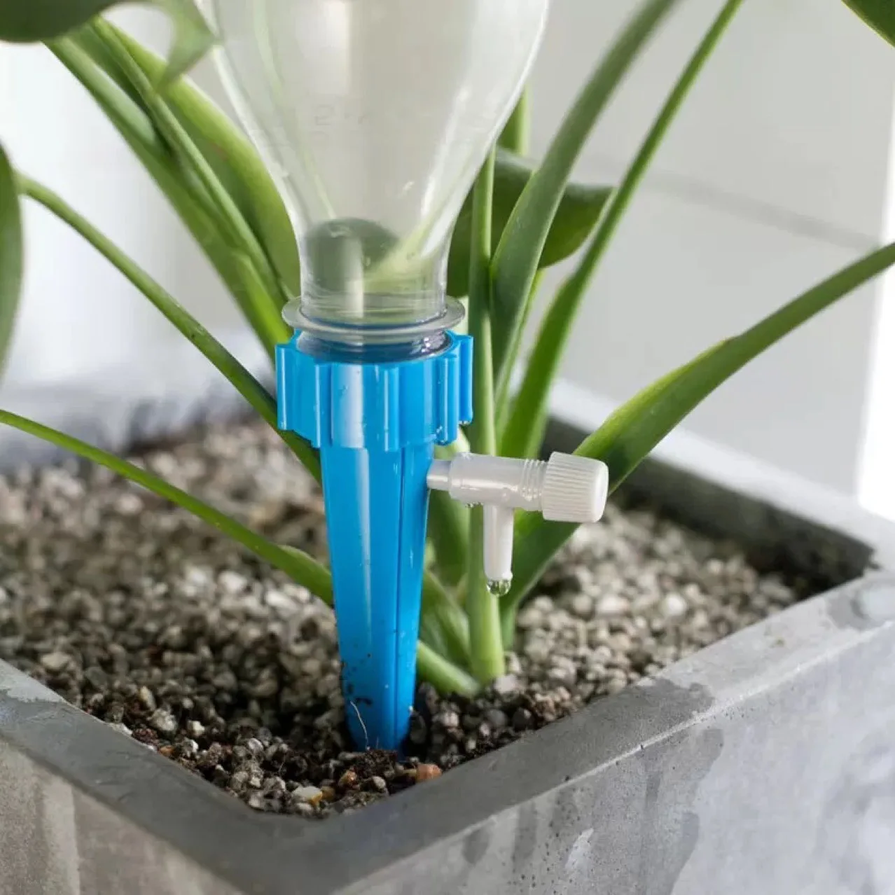 Automatic plant self watering spike with adjustable water drip irrigation system for home and vacation plant watering