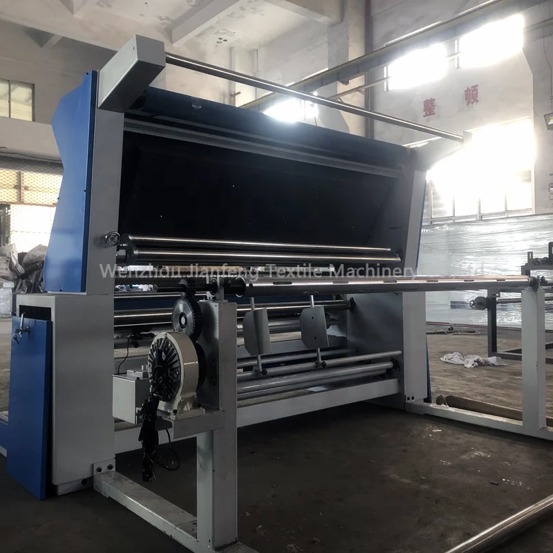 Textile fabric rewinding inspection machine