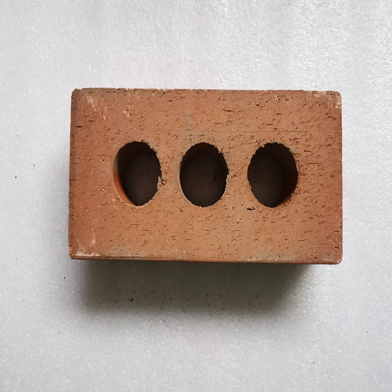 Perforated terracotta red clay bricks for construction