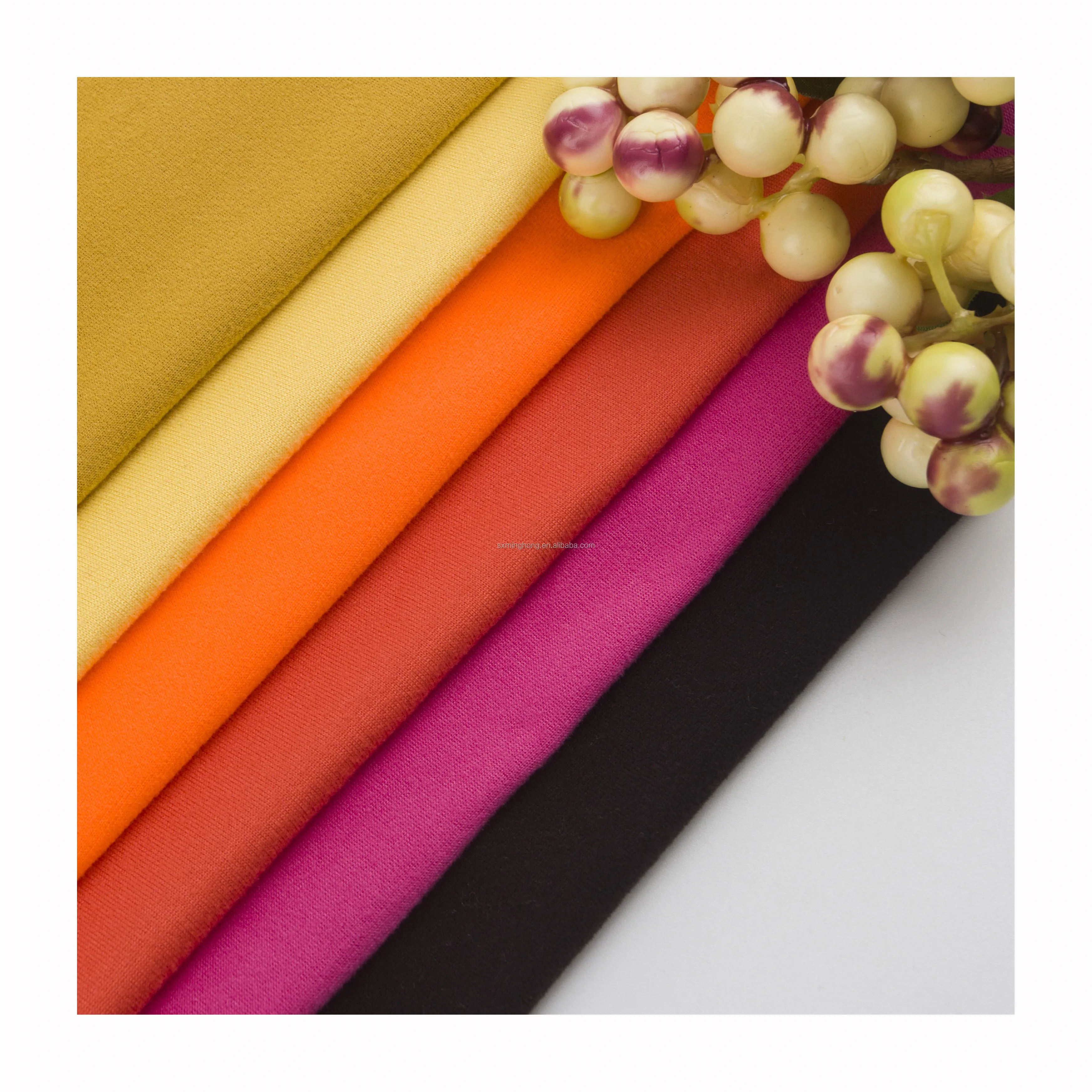 High quality soft beautiful knitted polyester milk silk DTY brushed fabric for cloth