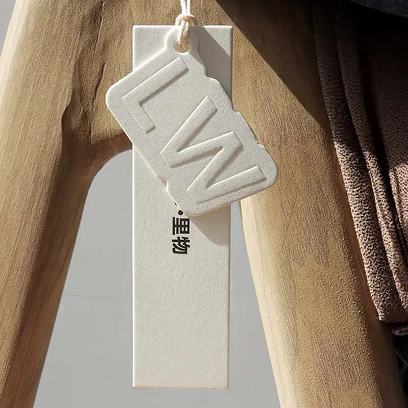 Custom clothing labels special shape white tags colorless embossed logo tags for clothes