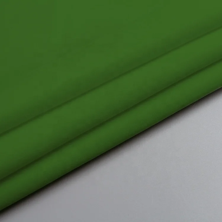 Green plain peach skin lining cloth roll material polyester fabrics for clothes