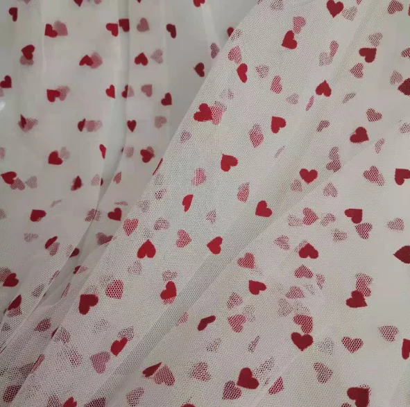 China manufacturer high quality fancy design soft tulle heart flocked mesh fabric for dress
