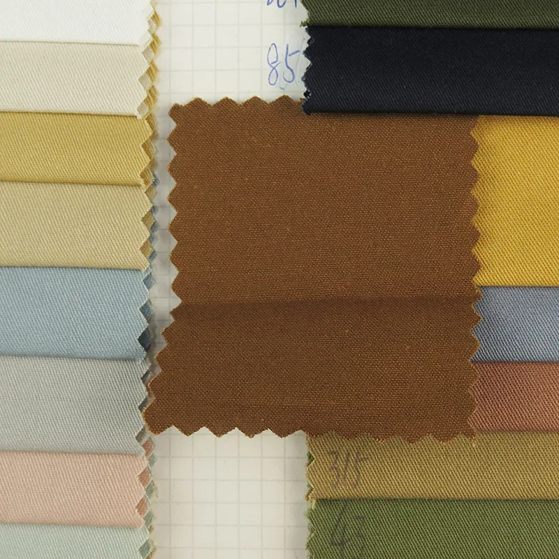 wholesale woven Singeing 32*21 Thicken High density twill Imitation 100% cotton fabric for Pants, jackets, shirts