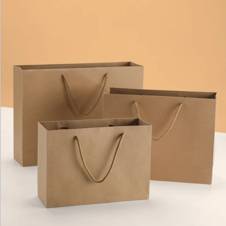 Factory wholesale kraft paper treat bags for clothes kraft paper bag with handles