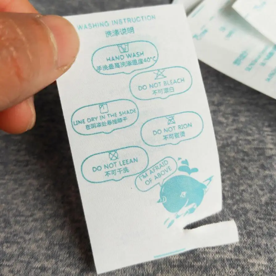 peel off washing instruction black tearaway fabric label,free sample tear away washing tags