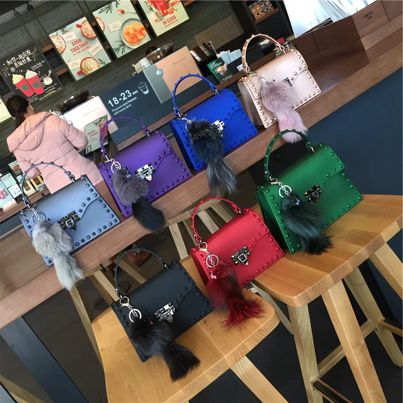 
2021 European and American new style frosted Matt PVC jelly bag trend color drill rivet portable one shoulder slant span bag 