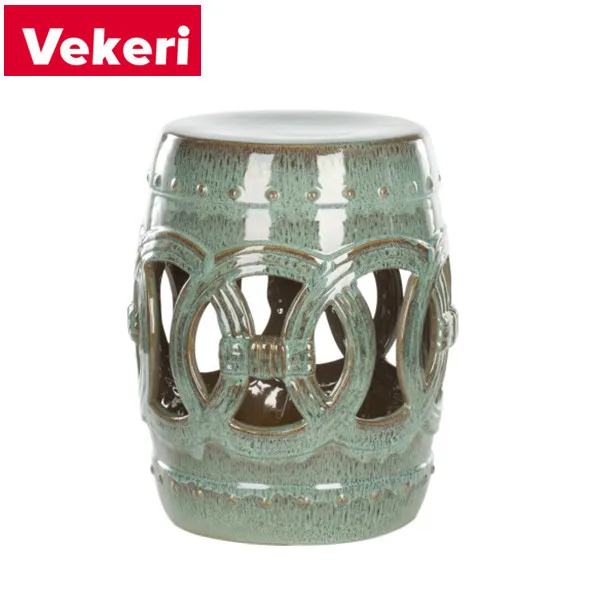 The modern Chinese side table is exquisitely made of green ceramics. The hollow shape can be placed in any space.