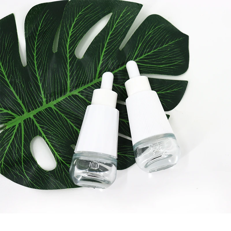 Wholesale 30ml Cosmetics Packing Taper Essential Oil Clear Glass Dropper Bottle With Plastic Outer Cover For Face Essence Serum